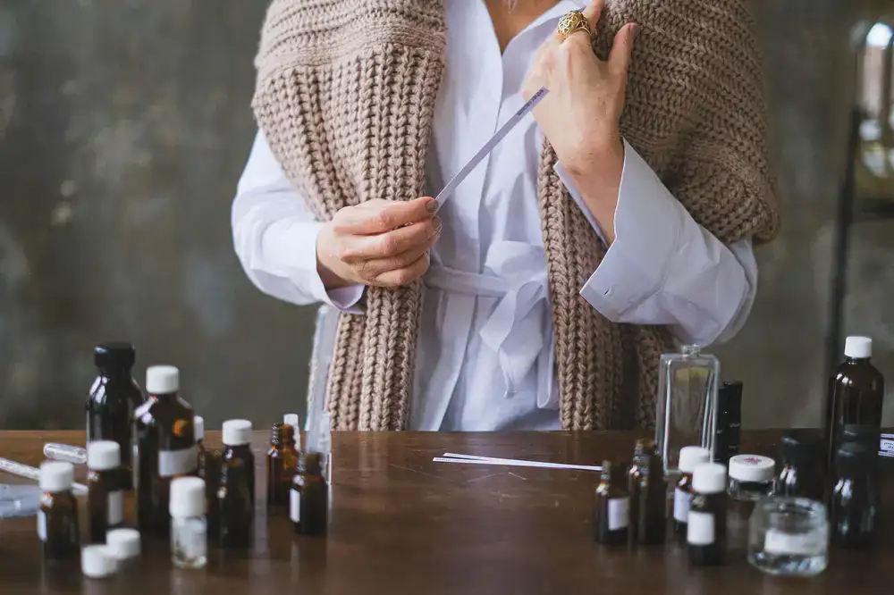 Close up of a perfumer evaluating a fragrance on a scent strip