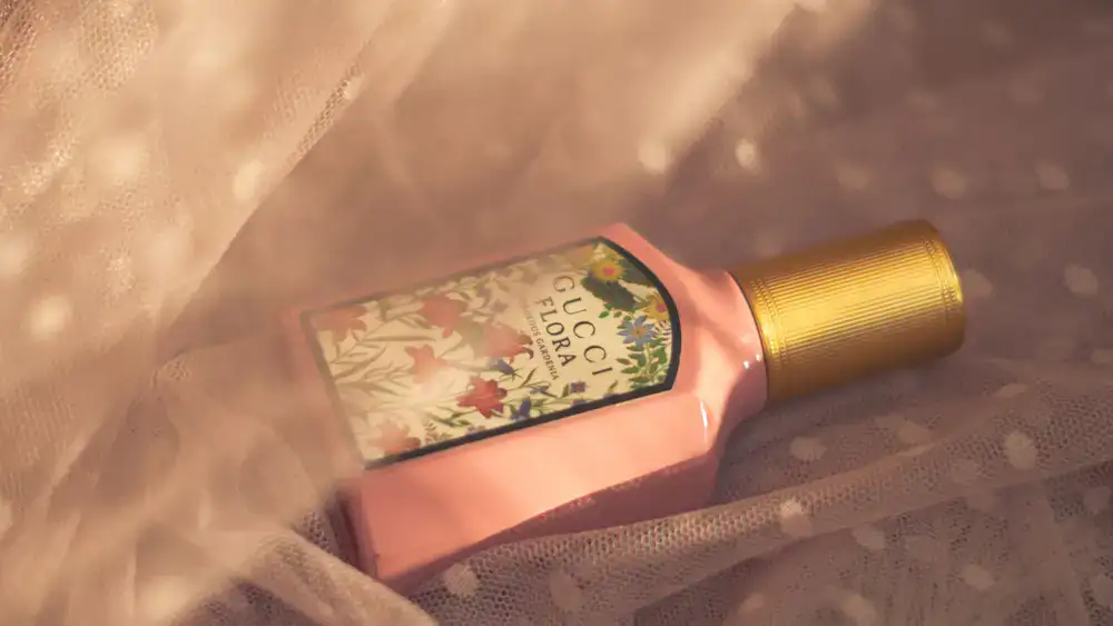 Close up of a signature perfume bottle catching warm light